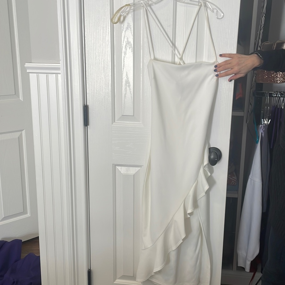 Windsor white prom dress size 4. Worn once with ruffle bottom and cross back